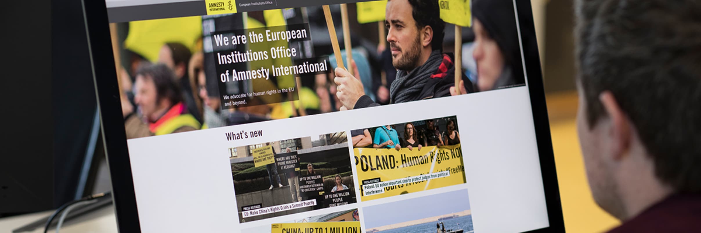 Amnesty International homepage on iMac screen